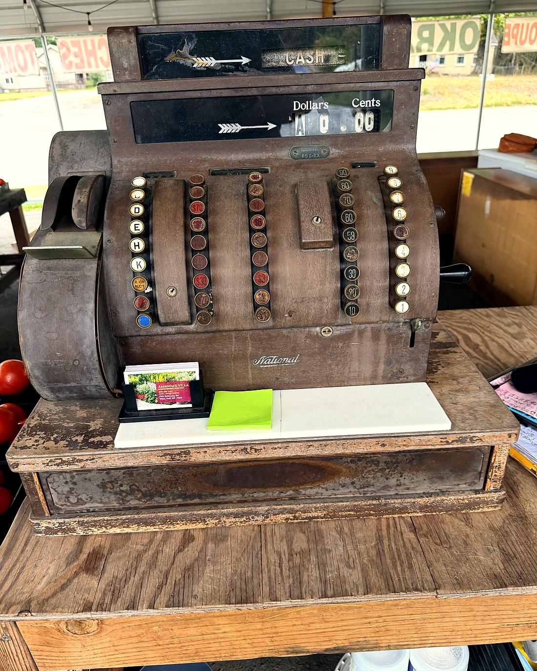 An antique brass cash register at the Amanda's Villa produce stand