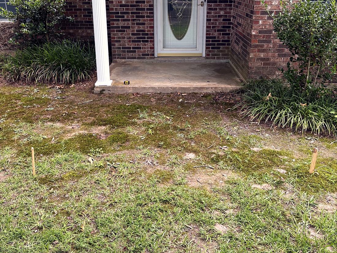 Before: Grass and dirt up to the front step