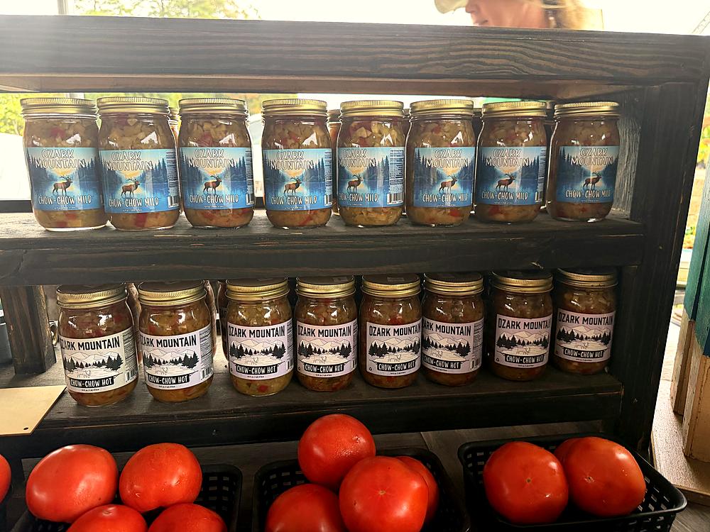 Jars of preserves above fresh tomatoes at the Amanda's Villa produce stand